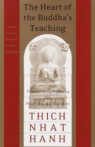 Cover of 'The Heart of the Buddha's Teaching' by Thich Nhat Hanh featuring a serene background.