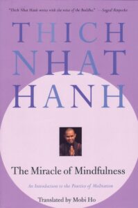 Cover of 'The Miracle of Mindfulness' by Thich Nhat Hanh with a peaceful, reflective design, among the best books on buddhism.