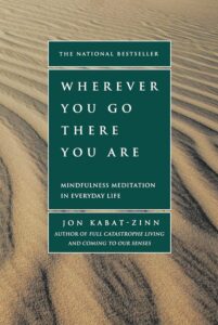 Cover of 'Wherever You Go, There You Are' by Jon Kabat-Zinn with a calming nature scene.