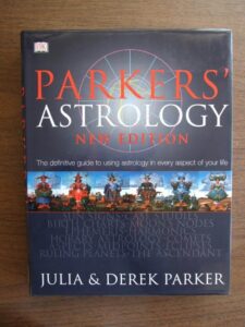 The cover of "Parker's Astrology" by Julia and Derek Parker, a visually appealing guide covering all aspects of astrology from basics to advanced chart interpretations.