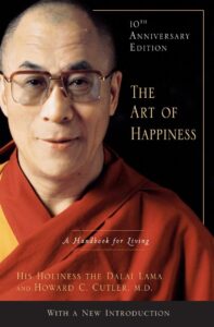 The cover of "The Art of Happiness" by Dalai Lama and Howard Cutler, recognized as one of the Best Books on Spirituality, combining spiritual and psychological perspectives on happiness.