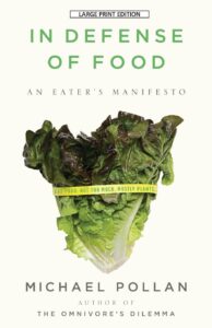 Cover of 'In Defense of Food' by Michael Pollan featuring a green lettuce, one of the best books on diet and nutrition