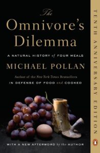 Cover of 'The Omnivore’s Dilemma' by Michael Pollan featuring a fork and knife.