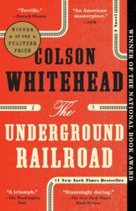 Cover of 'The Underground Railroad' by Colson Whitehead, showcasing a stylized illustration of railroad tracks intertwined with roots.