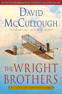 Cover of 'The Wright Brothers' by David McCullough, highlighting an old photograph of the Wright brothers with their early aircraft.