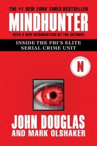 Cover of 'Mindhunter' by John E. Douglas and Mark Olshaker with a dark and enigmatic design.