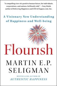 Cover of 'Flourish' by Martin E.P. Seligman, a leading book on happiness and well-being, introducing the PERMA model to enhance life satisfaction.