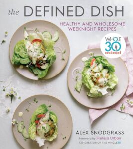 The cover of The Defined Dish by Alex Snodgrass, considered one of the Best Cookbooks for Healthy Eating