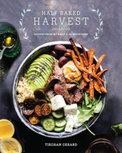 Cover of 'Half Baked Harvest Cookbook' by Tieghan Gerard, known for its beautiful photography and easy recipes for new cooks.