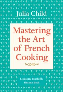 Cover of 'Mastering the Art of French Cooking' by Julia Child, a foundational guide for beginners interested in French cooking.